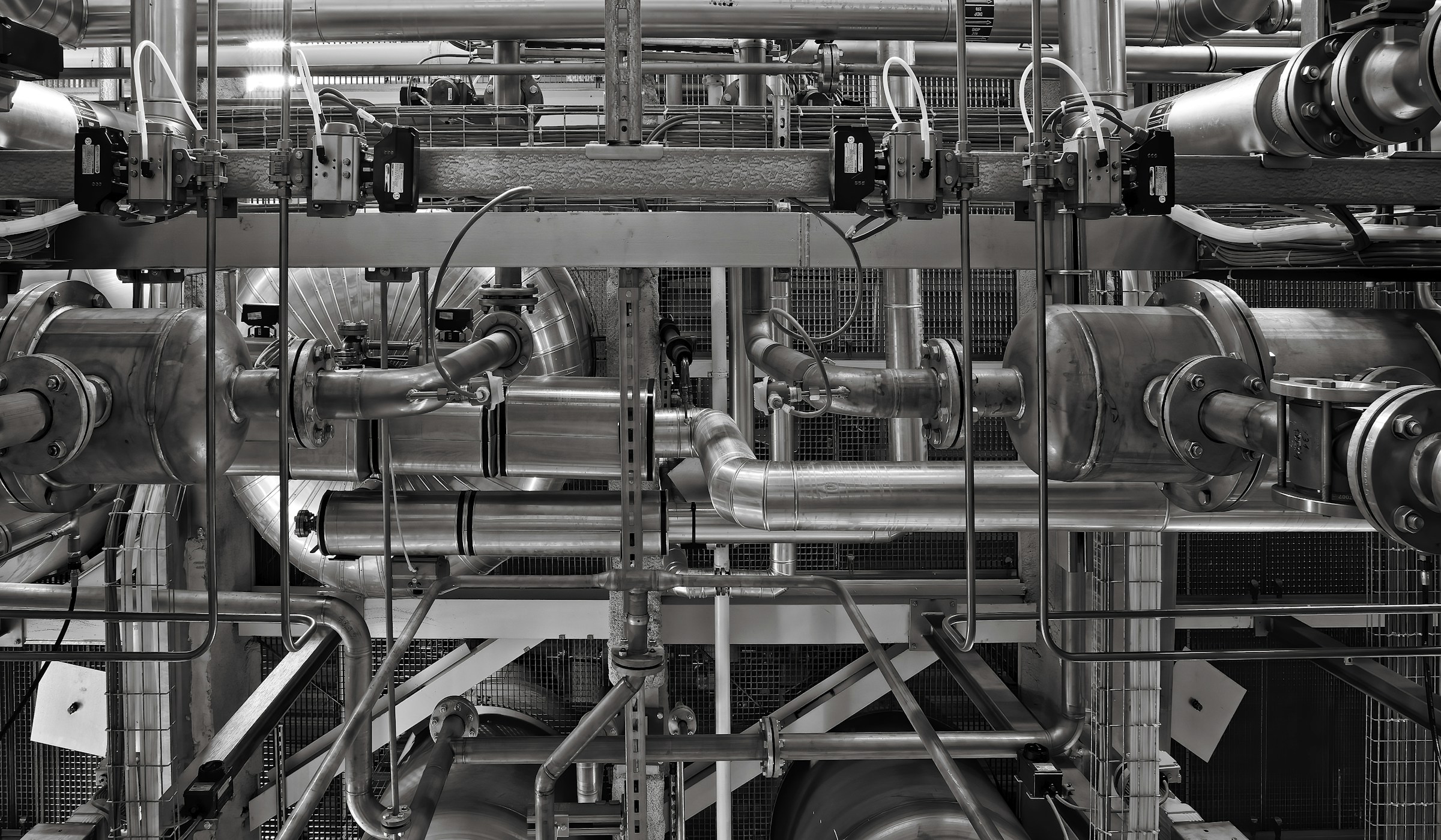 Close-up of stainless steel and red industrial machinery